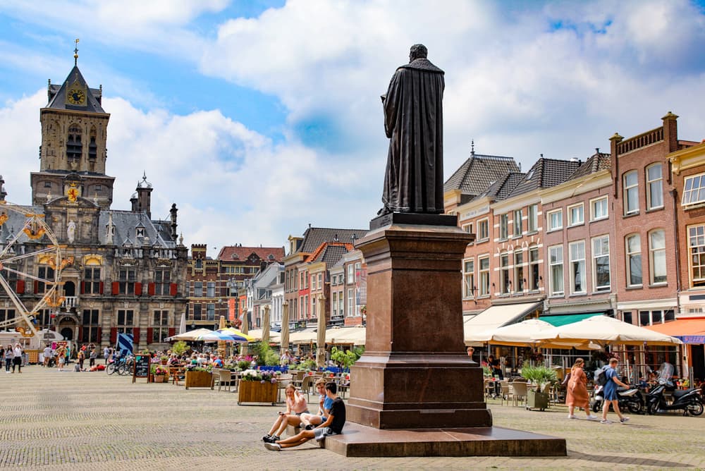 Market square in Delft with terraces and the town hall